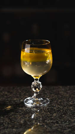 A cocktail of layered colors on a marble barの写真素材