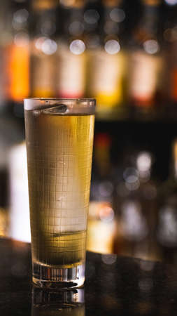 A drink at the bar at nightの写真素材