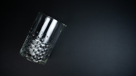 A mixing glass on a black backgroundの写真素材