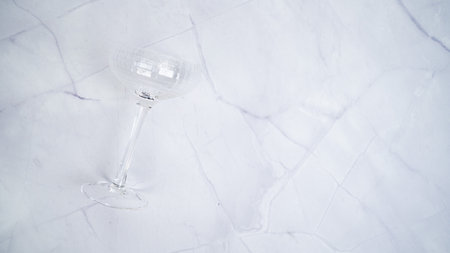 Coupe glass on white marble backgroundの写真素材