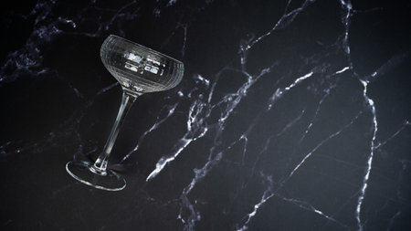 Coupe glass on black marble backgroundの写真素材
