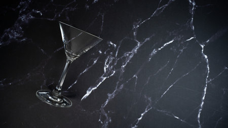 Martini glass on black marble backgroundの写真素材