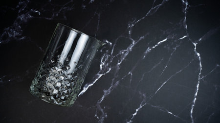 Mixing glass on black marble backgroundの写真素材
