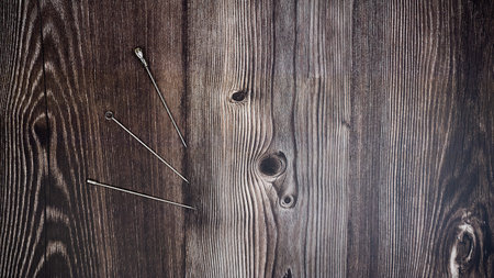 Three metal fruit fork on wooden backgroundの写真素材