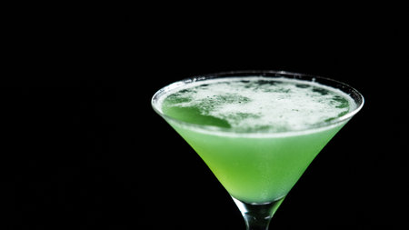 green cocktail on a black background, soft focus, close-upの写真素材