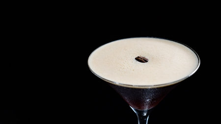 Cocktail with coffee beans on a black backgroundの写真素材