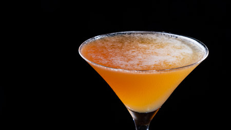 Cocktail on a black background. Cocktail with orange juiceの写真素材