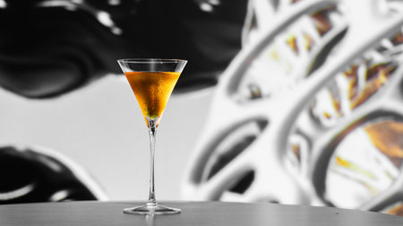 Cocktail in a martini glass on a black background.の写真素材