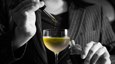 Woman with a glass of wine and a bottle of olive oil. Black and whiteの写真素材