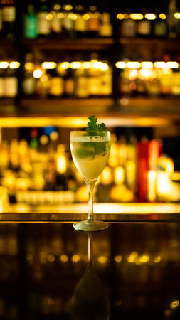 Cocktail on bar counter in night club. Cocktail with lime and mintの写真素材