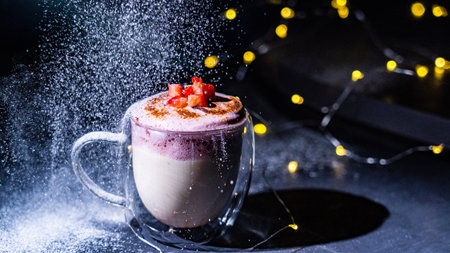 Panna cotta with whipped cream in a glass cup on a dark backgroundの写真素材