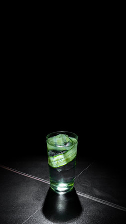 Aloe vera juice in a glass on a black background.の写真素材