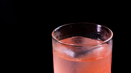 A glass of classic Ice Breaker cocktail on a black backgroundの写真素材