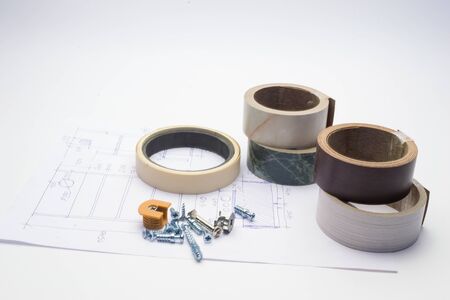 Furniture details and elements lie on a white sheet with product drawings.