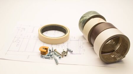 Furniture details and elements lie on a white sheet with product drawings.