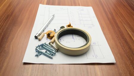 Furniture details and elements lie on a white sheet with product drawings.