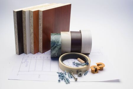 Furniture details and elements lie on a white sheet with product drawings.