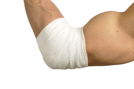 Male arm with elbow wrapped with bandage on whiteの写真素材