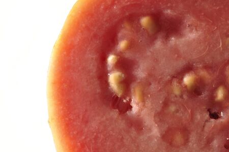 Closeup of flesh of pink guava on white backgroundの写真素材