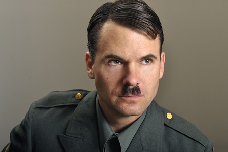 Head shot of stern military officer with narrow black mustacheの写真素材