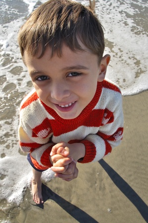 Superior angle view of happy boy at the beachの写真素材