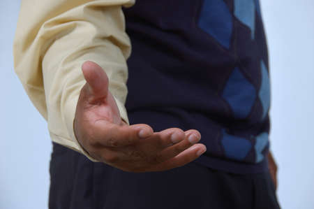 Man offers helping hand to cameraの写真素材