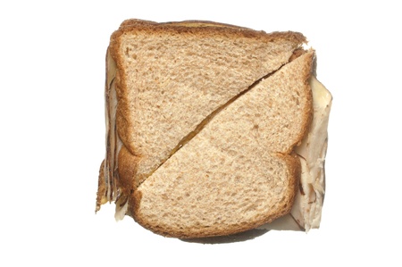 Closeup of simple lunch meat sandwich on wheat breadの写真素材