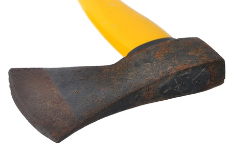 Macro closeup of old rusty ax head with yellow handle isolated on white backgroundの写真素材