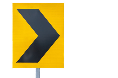 Yellow and black traffic arrow sign indicating curve isolated on white background