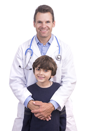 Portrait of Caucasian medical doctor in lab coat posing happily with his young eight year old son on white backgroundの写真素材