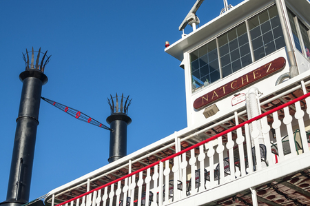NEW ORLEANS, USA - MARCH 12, 2014   The brightly colored Natchez riverboat is ready for another evening cruise on a beautiful clear day in New Orleansのeditorial素材