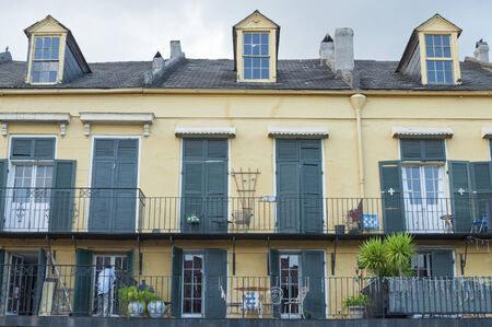 NEW ORLEANS, USA - OCTOBER 10, 2014: The French Quarter of New Orleans is characterized by a unique architecture, iron rail balconies and colorful exterior paint.のeditorial素材