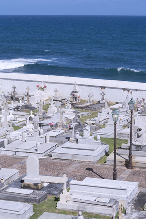 Santa Maria Magdalena de Pazzis cemetery in Old San Juan, Puerto Rico sits on top of the cliffs overlooking the Atlantic Ocean on a clear sunny dayのeditorial素材