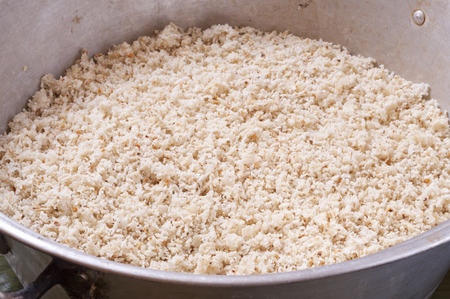 Large aluminum pan filled with fresh ground white maize corn for making tamalesの写真素材
