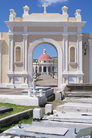 Beautiful architecture and arches compliment graves on a sunny day at Santa Maria Magdalena de Pazzis cemetery in Old San Juanのeditorial素材