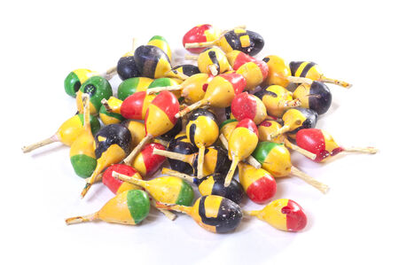 Pile of colorful spark throwing Mexican firecrackers on white background
