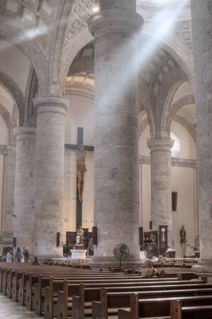 MERIDA, MEXICO - JANUARY 19, 2015: Beams of sunlight enter through rotunda windows inside the historical Cathedral of Ildefonso in Merida, Yucatanのeditorial素材