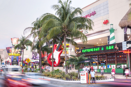 CANCUN, MEXICO - JANUARY 22, 2015: The area around the Forum on Kukulkan Boulevard is alive with tourist activity on the hotel zone of Cancuanのeditorial素材