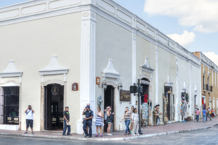VALLADOLID, MEXICO - JANUARY 20, 2015: Tourists enjoy shopping and viewing old historical architecture in the tranquil city of Valladolid, Mexicoのeditorial素材