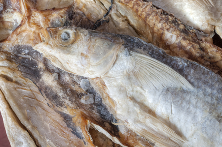 Closeup of dry salted whole mullet fishの写真素材