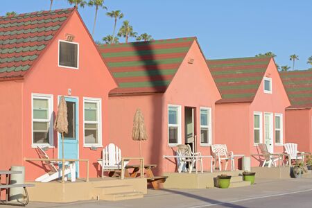 OCEANSIDE, USA - APRIL 27, 2015: Cute pastel-colored beach themed cottages are available as vacation rentals along the almost always sunny coast in Oceanside, California.のeditorial素材