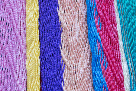 Macro closeup intricate nylon weave of multi-colored Mexican hammockの写真素材