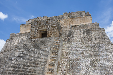 Closeup detail of architectural style at top of Pyramid of the Magician at Maya archaeological site of Uxmal in Yucatan, Mexicoの写真素材