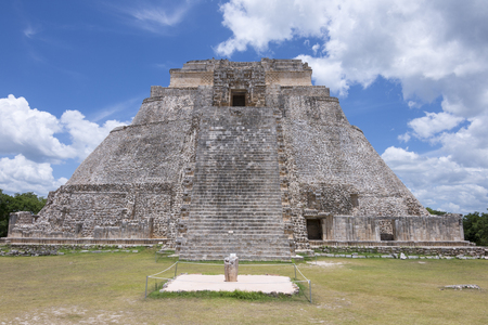 Impressively large Pyramid of the Magician at the ancient Maya city of Uxmal in Yucatan, Mexico under sunny blue skyの写真素材