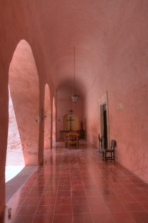 Beautifully colored interior hallway and tile floor of San Bernardino de Siena convent in Valladolid, Yucatan, Mexicoの写真素材