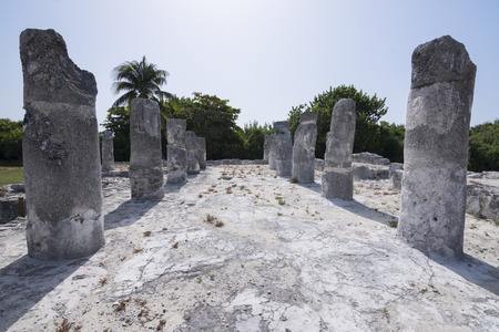 Diminishing perspective of stone columns and shadows at Maya ruins El Rey in Cancun, Mexicoの写真素材