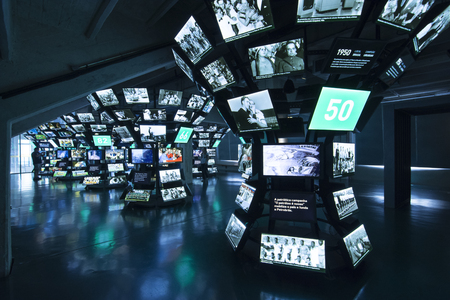 SAO PAULO, BRAZIL - SEPTEMBER 23, 2015: Columns of monitors display historical moments in the history of football soccer at the Museum of Football at Estdio Municipal Paulo Machado de Carvalho in Sao Paulo, Brazilのeditorial素材
