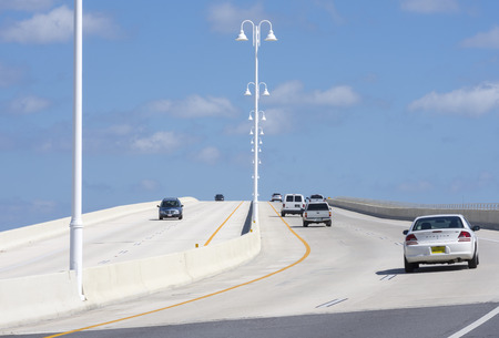 ST. PETERSBURG, FLORIDA, USA - FEBRUARY 25, 2016: Two-way traffic and a pedestrian walkway on the highway 682 concrete bridge connect St. Pete Beach and Isla del Sol on Florida's gulf coast.のeditorial素材