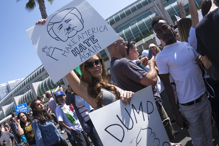 SAN DIEGO, USA - MAY 27, 2016: A pretty woman shares her thoughts about Donald Trump at an organized protest outside a Trump rally in San Diegoのeditorial素材