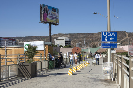 TIJUANA, MEXICO - AUGUST 20, 2016: Travelers returning from Tijuana can now use the temporary walkway to the new San Ysidro port of entry PedWest facility when going to the United States.のeditorial素材